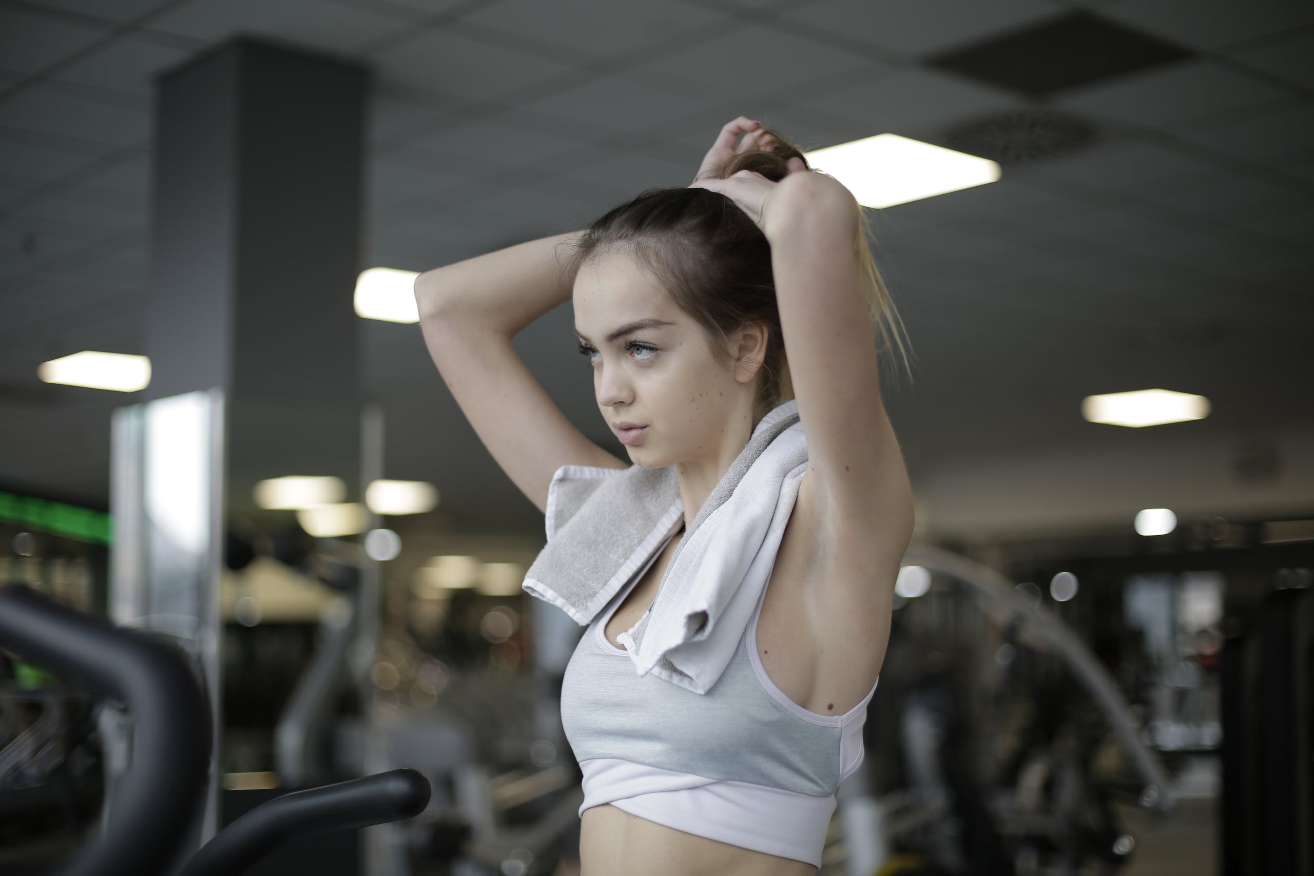 Woman Tying Her Hair